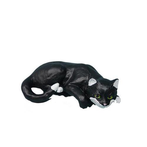 Decorative sculpture designed as a relaxing black white colored cat with green eyes 45cm