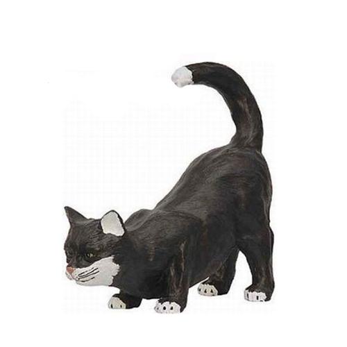 Decorative sculpture designed as a motley black white colored cat in hunting pose 40cm