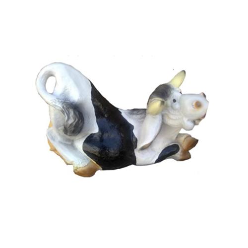 Decorative sculpture designed as a relaxing black white colored cartoon cow 38cm