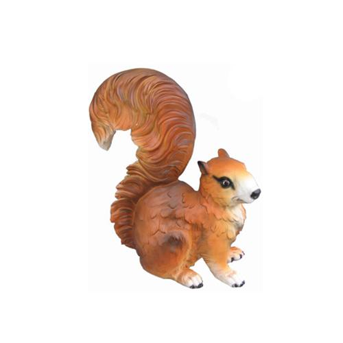 Decorative sculpture designed as a motley brown white colored shaggy squirrel 38cm