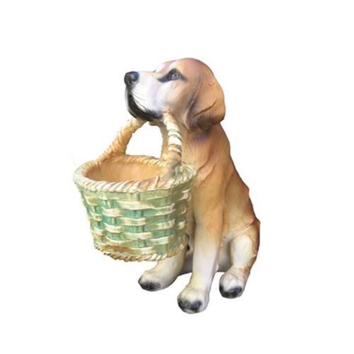 Decorative sculpture designed as a motley brown white colored sitting dog with a basket in mouth 38cm