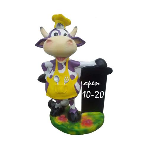 Restaurant decorative sculpture designed as a cartoon cow dressed in yellow suit with a board 55cm