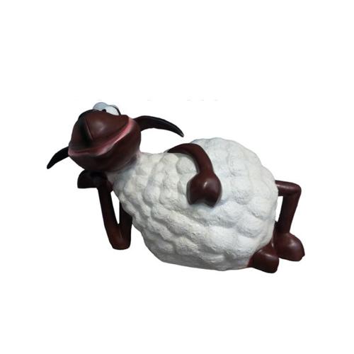Deco figure designed as a cartoon shite colored sheep lean against ground 60cm