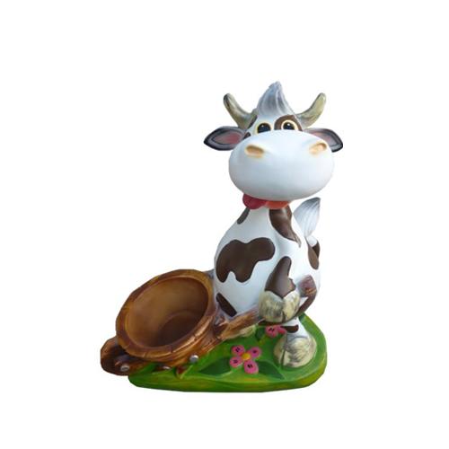 Deco cartoon colorful figure of a motley brown white cow carrying a wheelbarrow 38 cm.