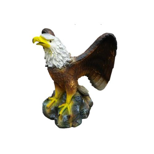 Original colored deco figure of an eagle with open wings on a stone 50cm