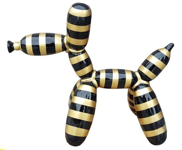 Abstract decorative sculpture designed as balloon animal figure with black gold stripes