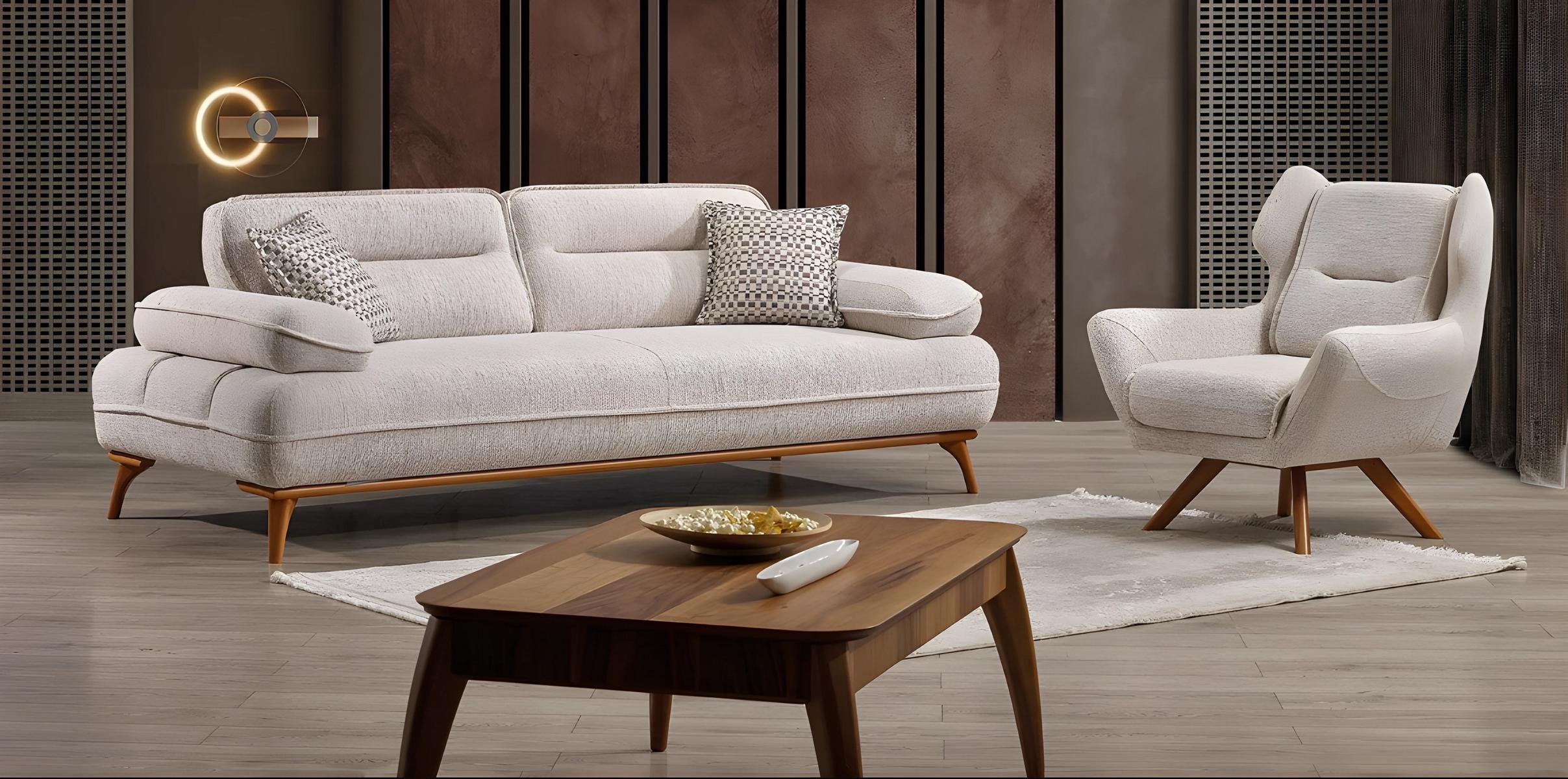 Modern white fabric sofa and armchair in an elegant living room set.