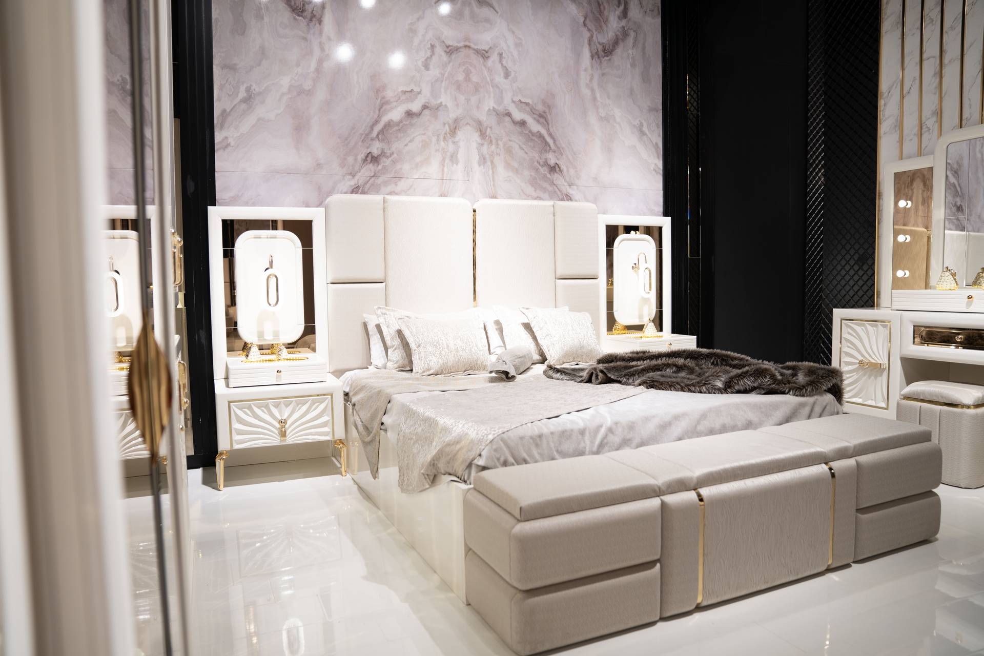 Elegant wooden bedroom set in beige with bed and nightstands.