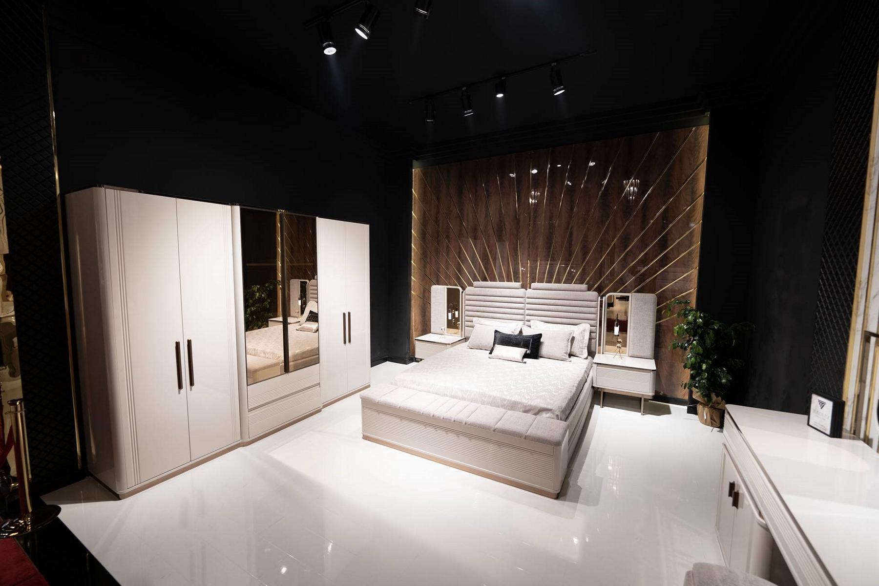 Elegant wooden bedroom set in beige with mirror and storage space.