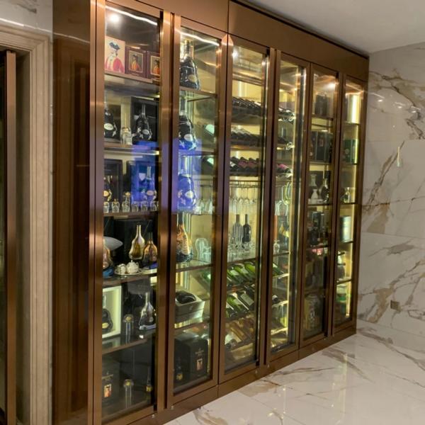 Elegant golden wine cabinet made of high-quality stainless steel for