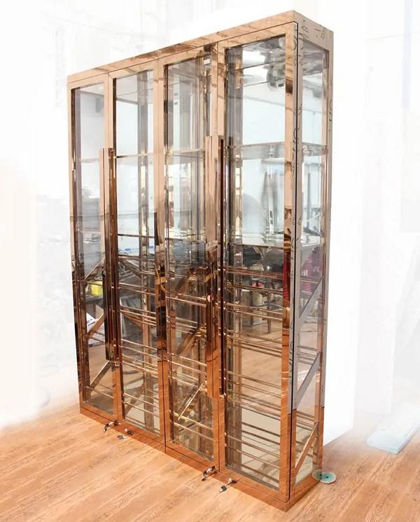 Elegant wine cabinet made of stainless steel in gold with dual-zone cooling