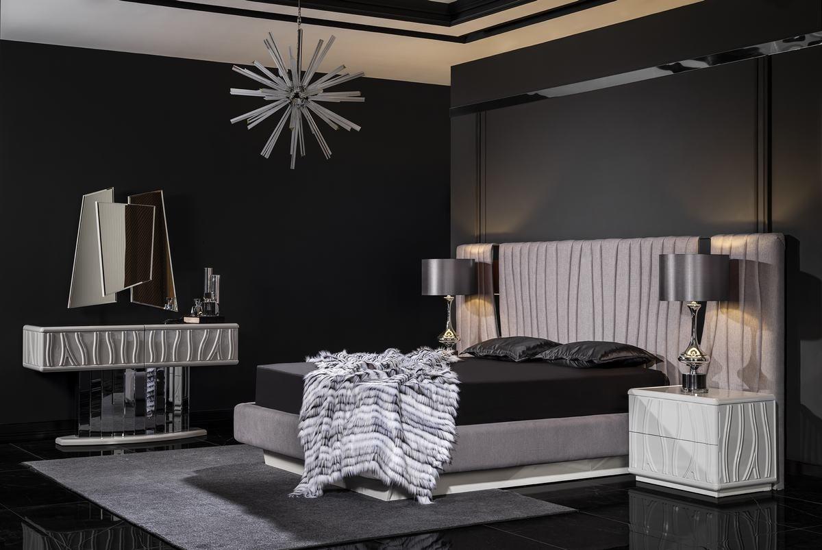 Elegant white wooden bedroom furniture set with mirror.