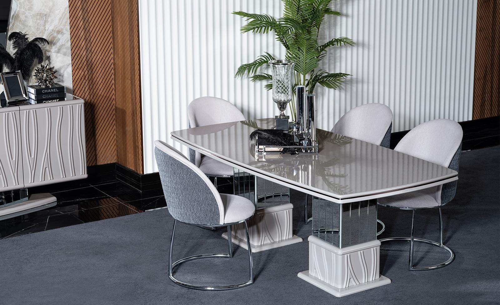 Elegant white dining table and chair set made of wood and metal.