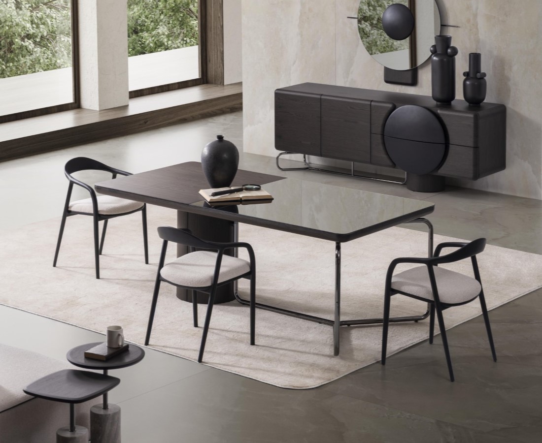 Black dining room set made of wood with dining table and chairs in a modern style.