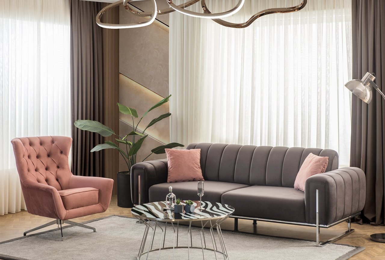 Modern sofa and armchair combine elegance and comfort.