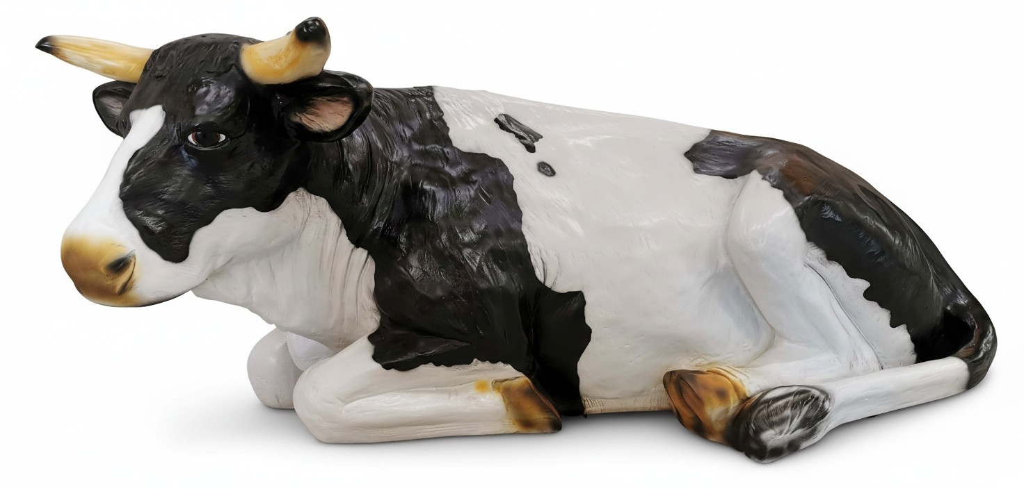 Motley black white colored decorative garden sculpture designed as a resting cow (A138A)