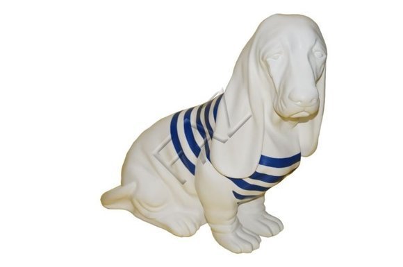 Decorative garden sculpture designed as full white colored dog figure with blue stripes