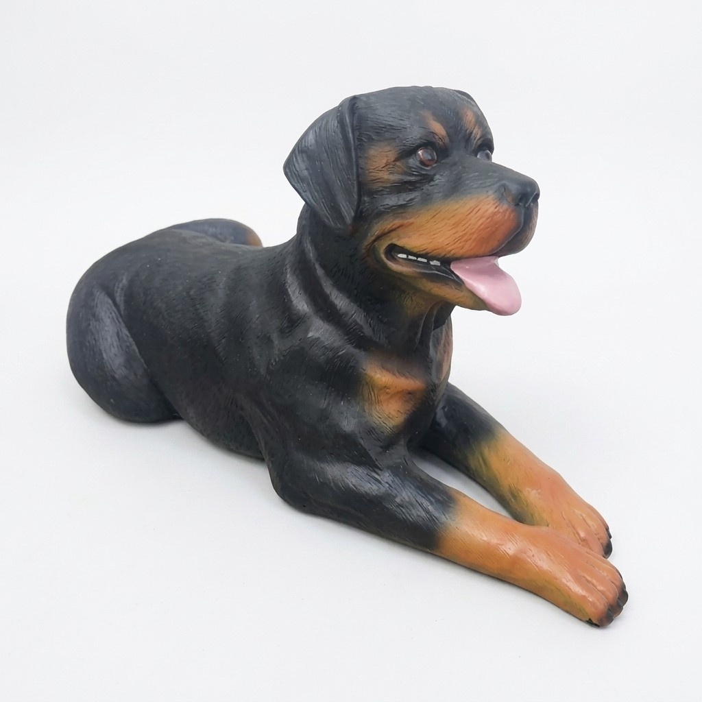 Decorative sculpture designed as an lying motley rottweiler dog 50x80cm A195