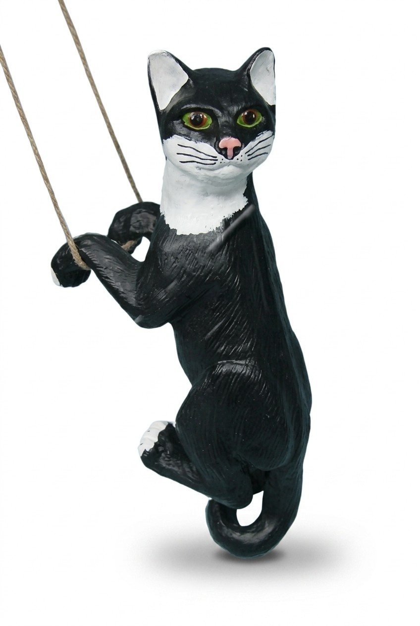 Decorative sculpture designed as a mobley black white colored cat on a rope 50cm height C206