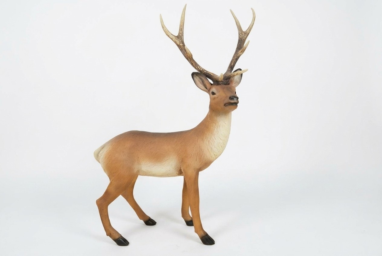 Decorative sculpture designed as bright light motley colored deer with massive horns