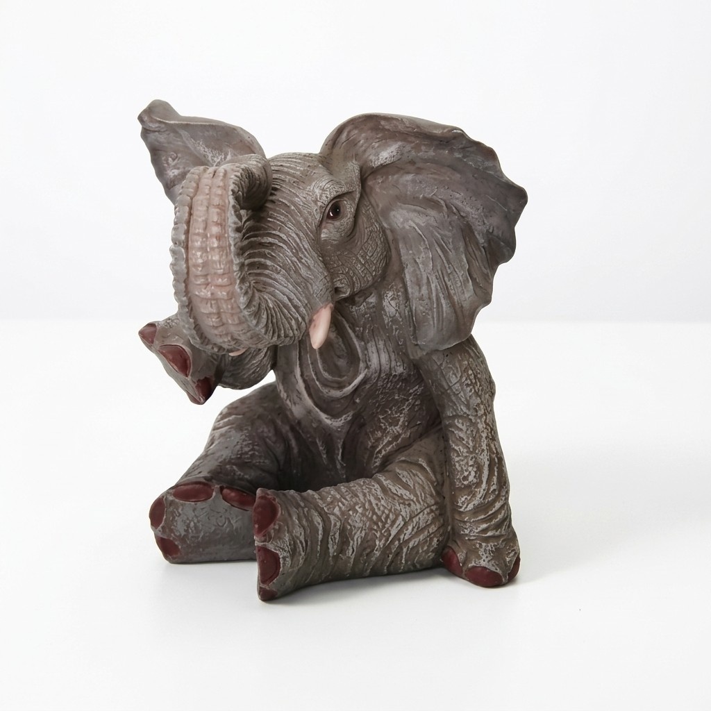 Dark grey colored decorative garden sculpture of sitting elephant figurine