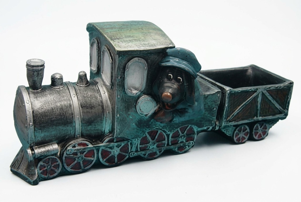 Full black colored decorative figure of mole miner on a traktor carrying a trolley C259