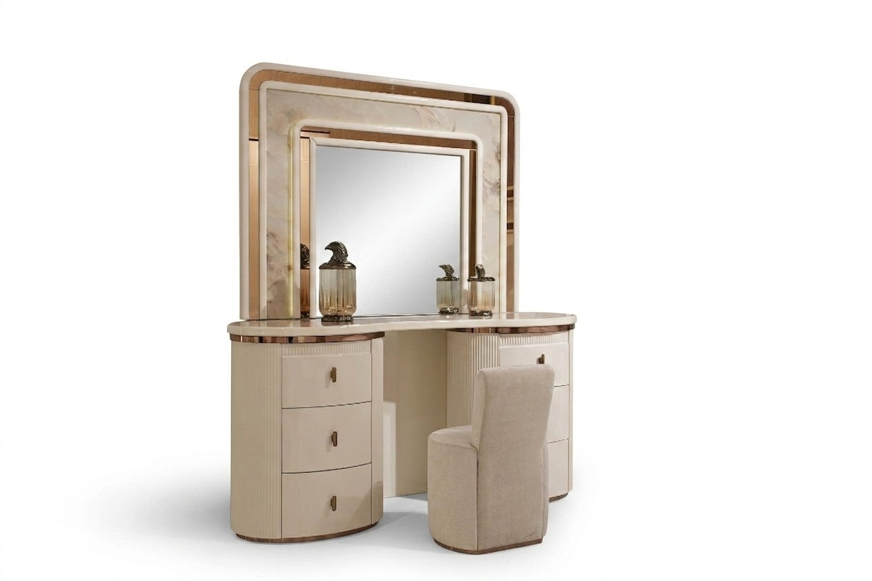 Elegant white wooden vanity table with mirror and stool.