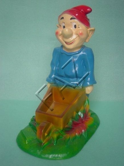 Decor figure designed as boy carrying a wooden rectangular wheelbarrow 43x36cm