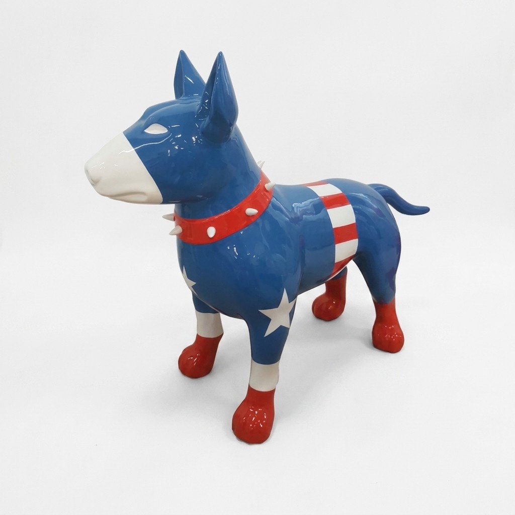 Decorative sculpture designed as a gloss standing bull terrier in classic superman kit colored 85x116cm