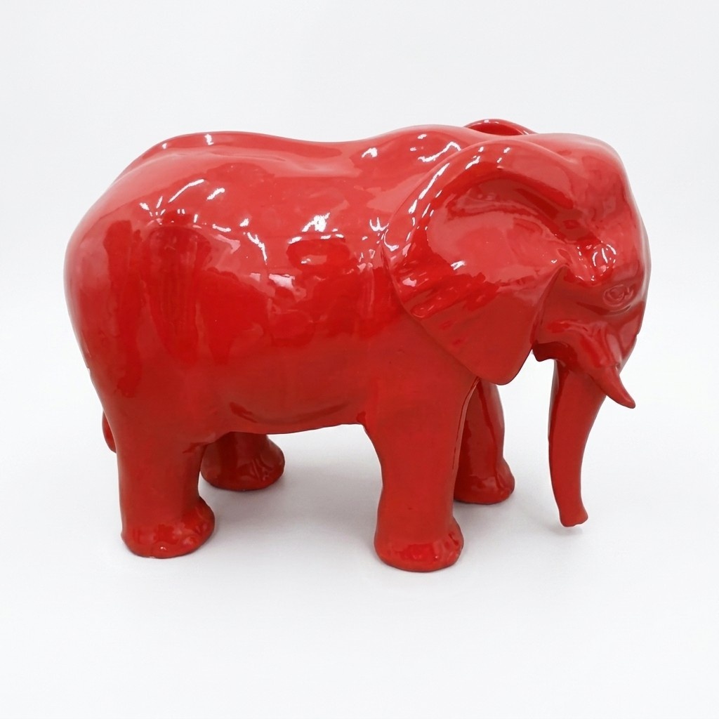 Full red colored decorative sculpture designed as a gloss standing elephant 60x81cm