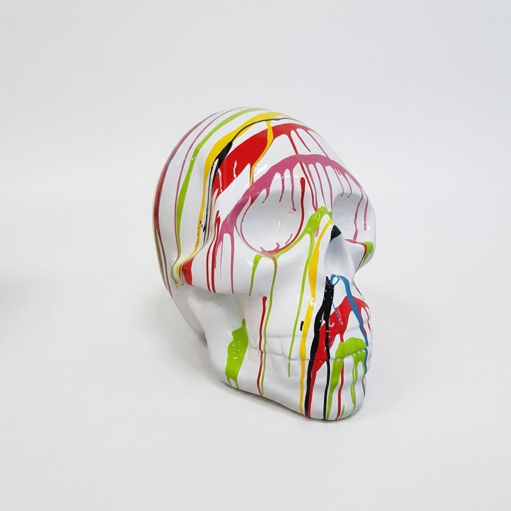 Abstract white colored decorative sculpture designed as a skull in colorful stripes 66cm