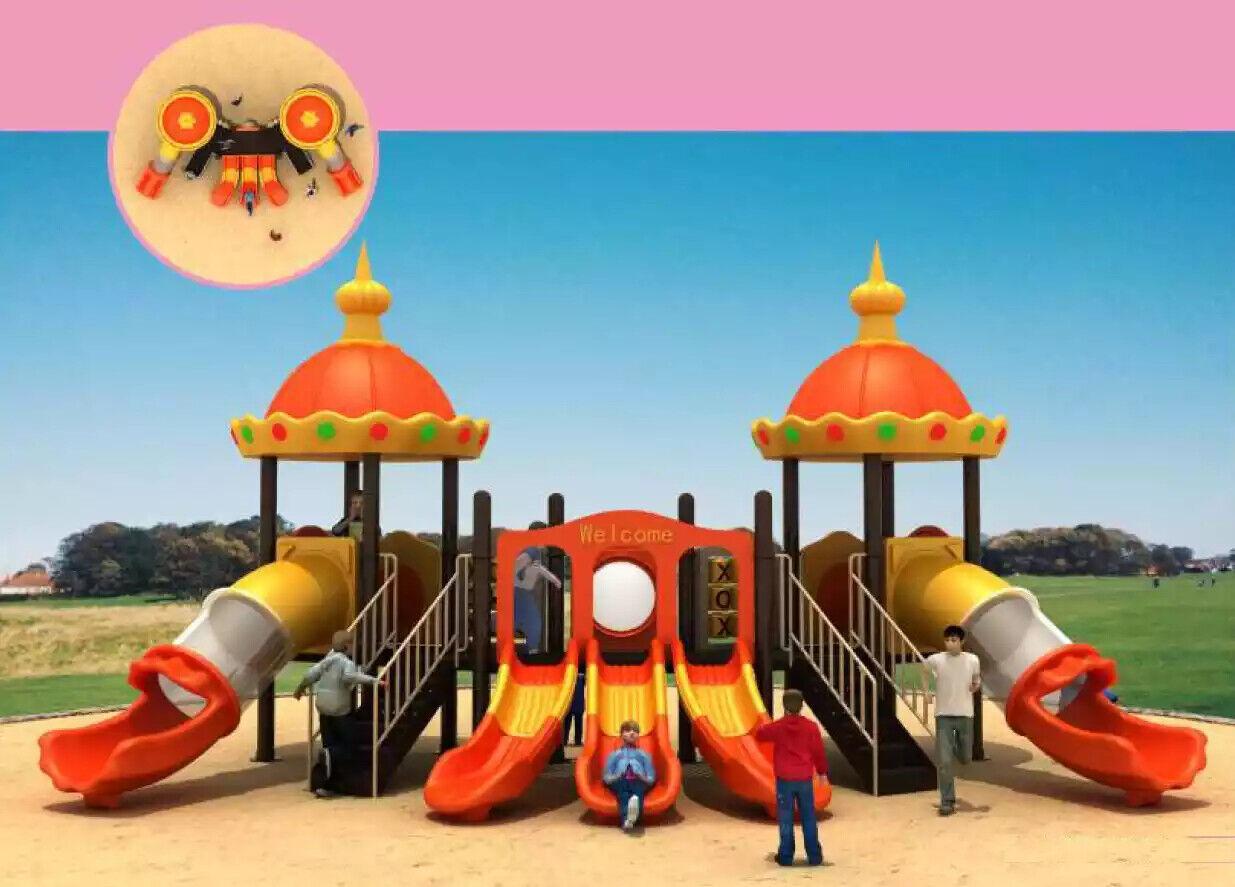 Colourful children\'s playground in the inner courtyard in spaceship style with slides