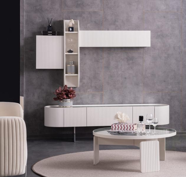Living room set with wall unit, coffee table, sideboard, and mirrored wall shelf in white.