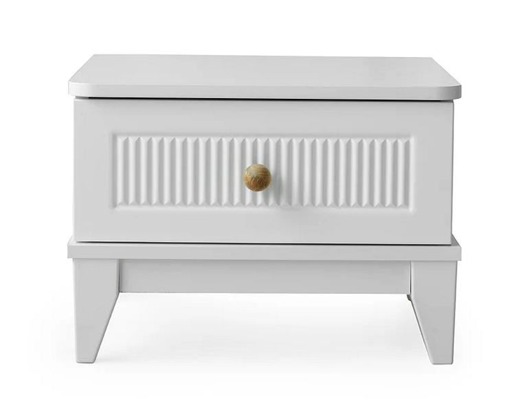 Compact bedside table for the children\'s room with drawers in stylish design.