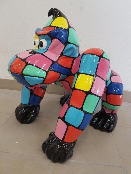 Abstract modern style decorative sculpture designed as colorful cartoon gorilla with round eyes 70cm height