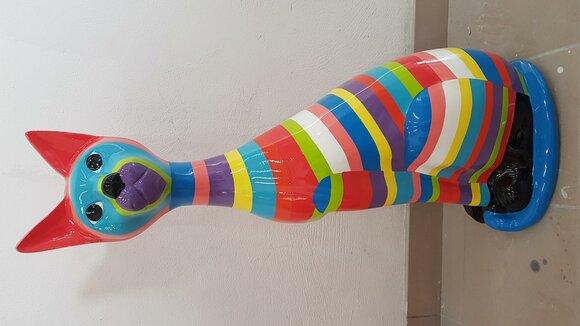 Decorative gloss sculpture in modern style designed as an abstract sitting cat with colorful stripes 98cm