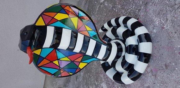 Decorative abstract sculpture designed as colorful standing cobra with stripes 90cm height