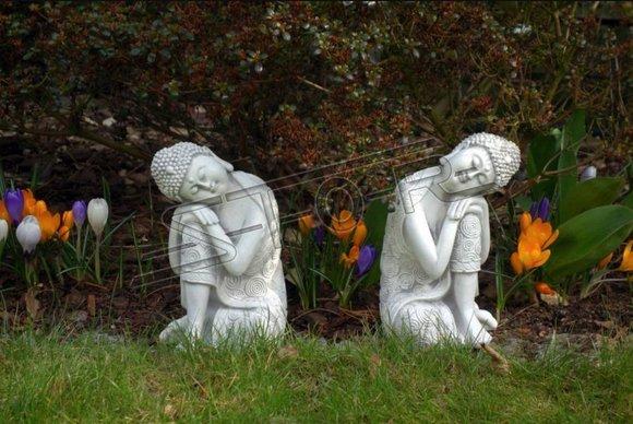 Buddha sculpture in stone look. Large sculpture for garden and living area
