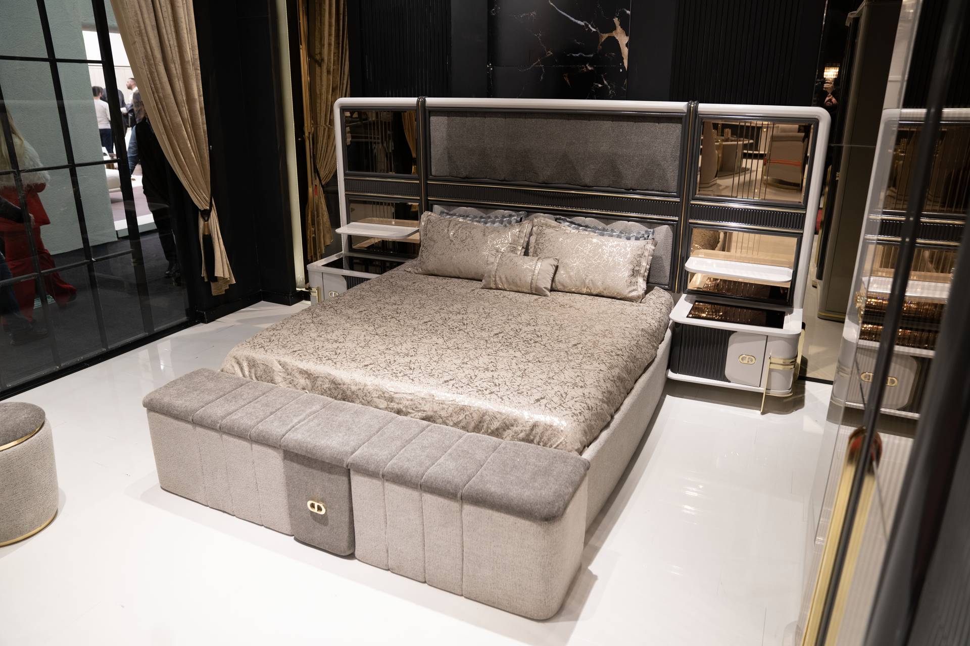 Bedroom set made of wood in beige with bed, nightstands, and bench.