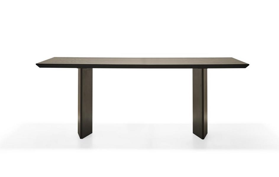Elegant wooden dining table in warm brown for a modern home.