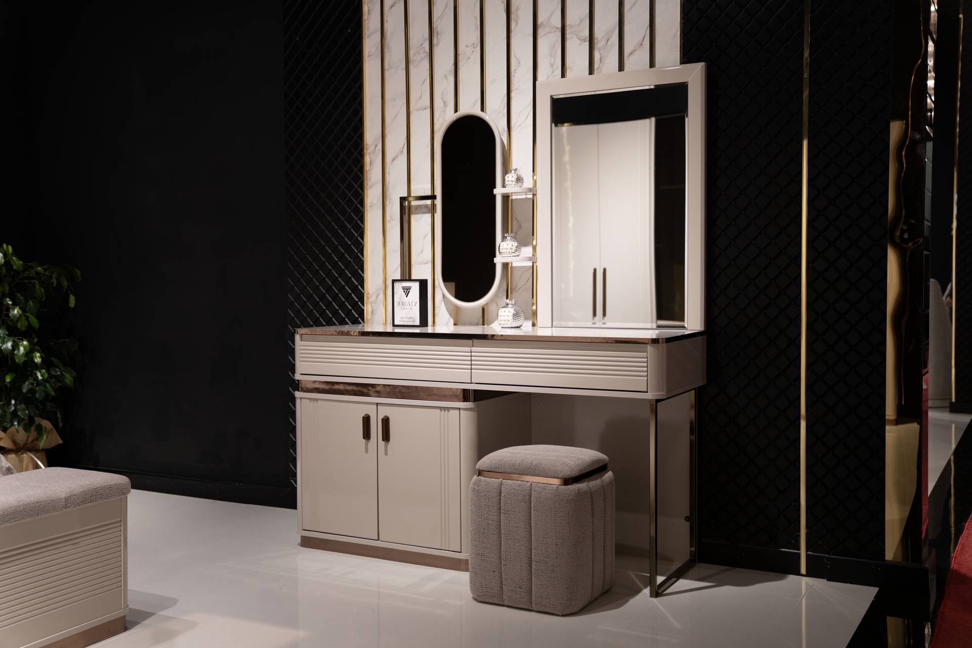 Elegant beige makeup table with mirror and wooden stool.