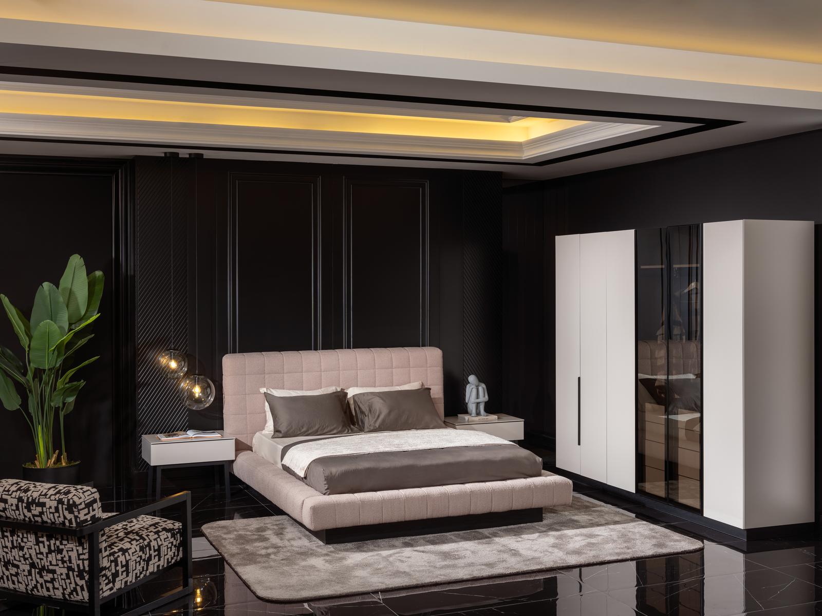 Elegant beige bedroom set made of wood and fabric.