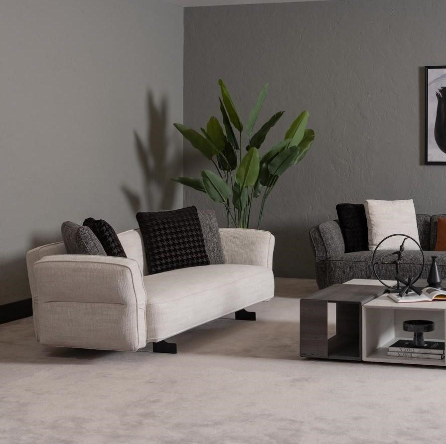 Modern beige textile 3-seater sofa with a wooden frame.