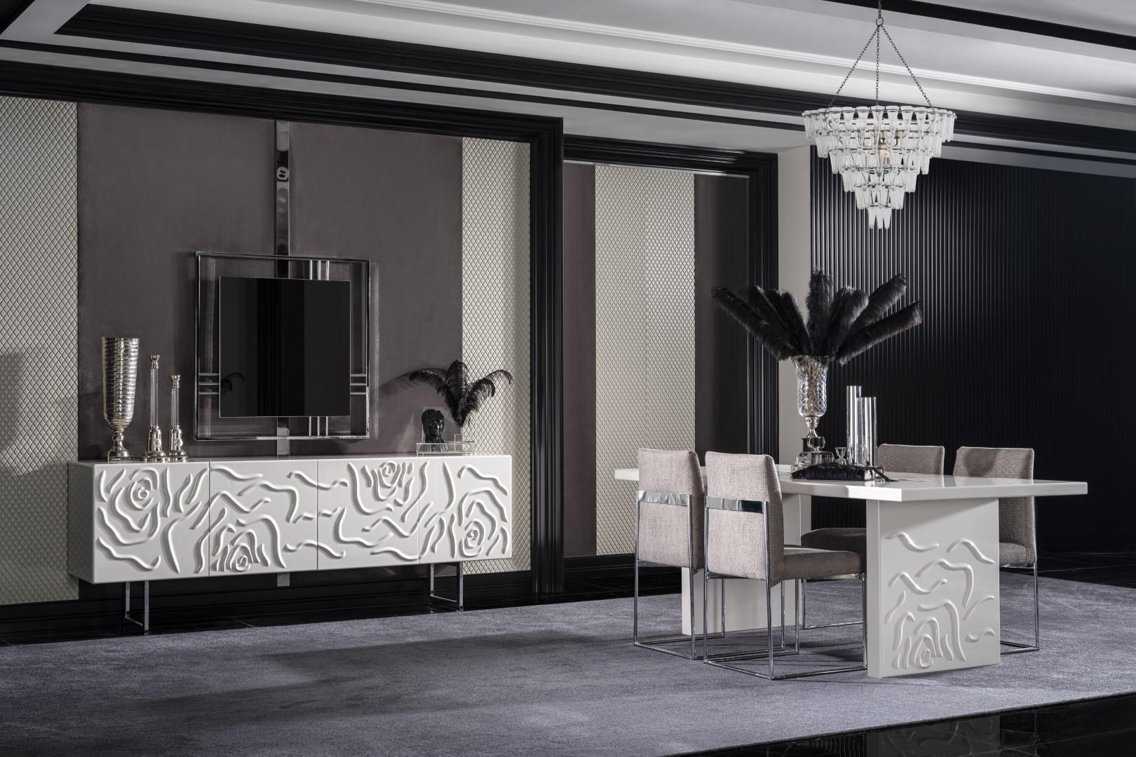 Elegant white dining room set made of wood with mirror and sideboard.