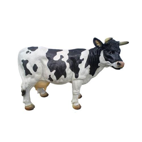 Decorative sculpture designed as a motley black white colored standing cow 40cm