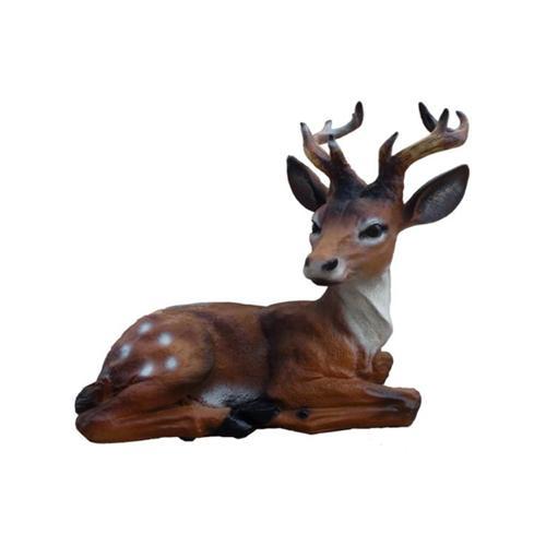 Decorative sculpture designed as a dark brown motley colored lying deer with horns 45 cm