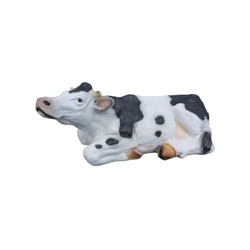 Decorative sculpture designed as a motley white black colored lying cow 70cm
