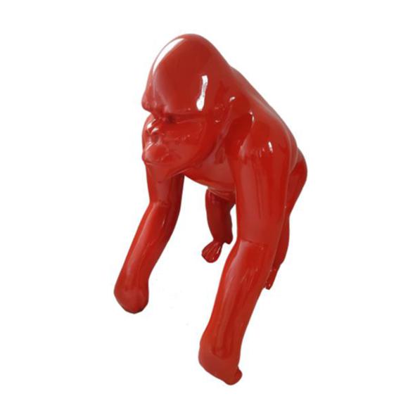 Abstract decorative sculpture designed as a gloss full red colored standing gorilla 70cm
