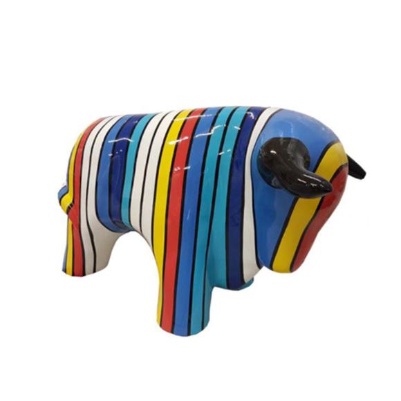 Decorative sculpture designed as gloss standing bull in colorful stripes 40x70cm