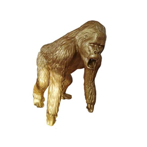 Abstract decorative sculpture designed as a gloss full golden colored gorilla 130cm